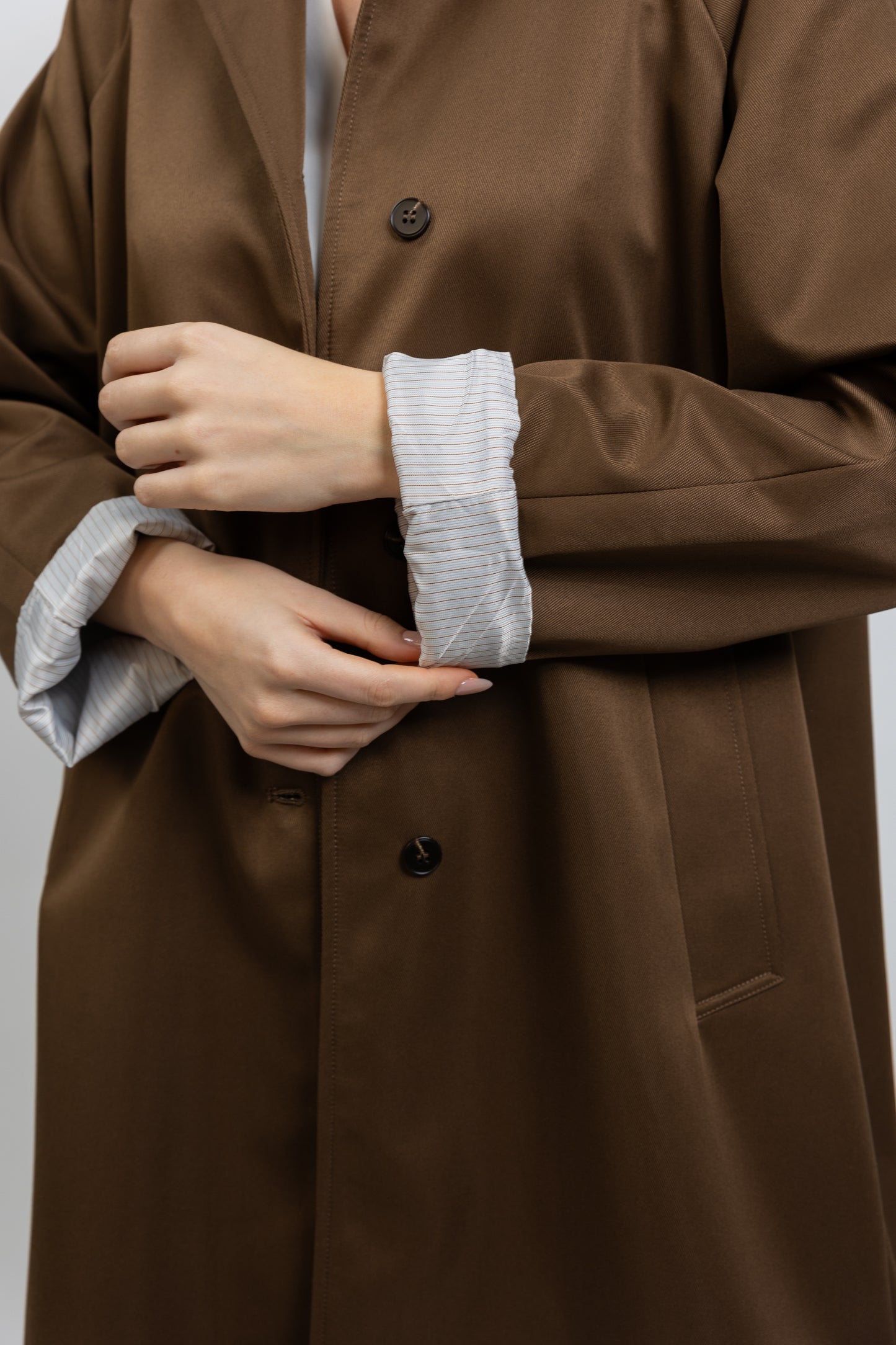Trench coat with striped lining