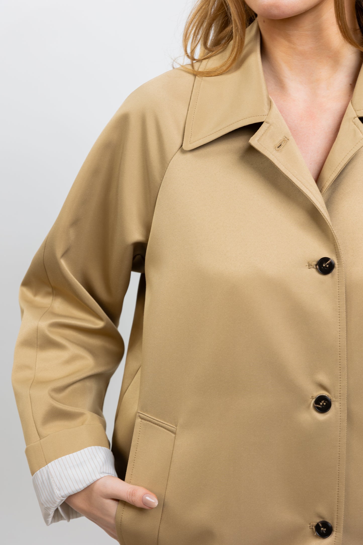Trench coat with striped lining